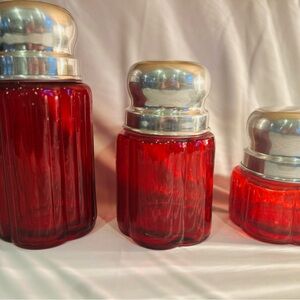 Elegant Red Glass Jars with Silver Lids
